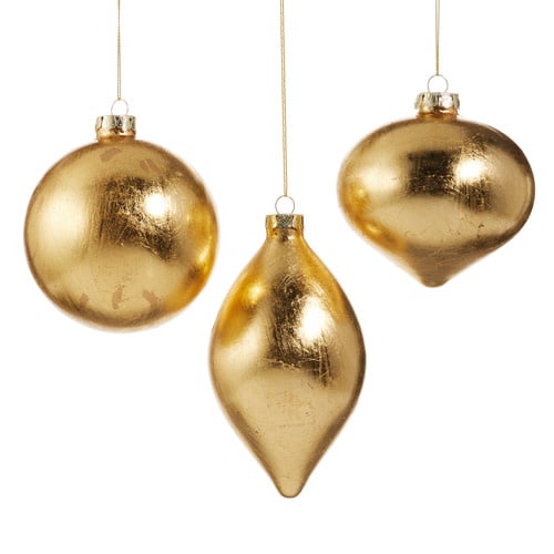 Glass ornament with gold foil leaf detailing on a spherical shape