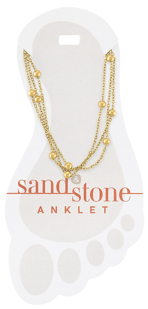 Gold multi-strand anklet with sand-colored beads and stone accents on a chain link