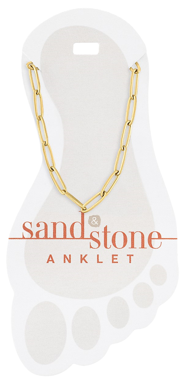 Gold paperclip chain anklet with sand-colored stone accents on a neutral background
