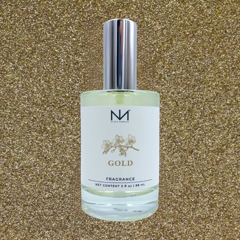 Gold Perfume bottle with a metallic gold finish and clear glass body.
