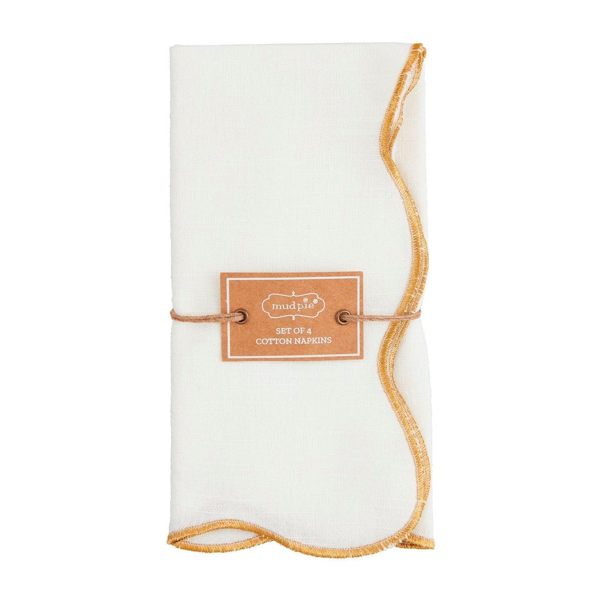 Four gold scallop-edge cotton dinner napkins arranged on a neutral surface.