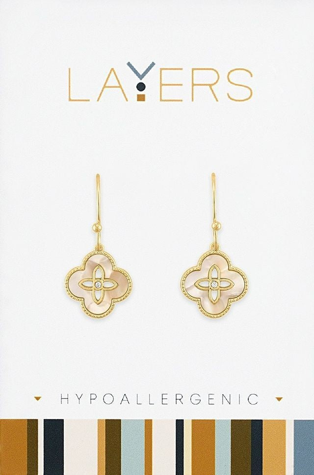 Gold hypoallergenic dangle earrings featuring layered seashell shapes in a quatrefoil silhouette.