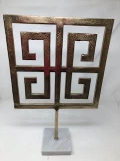 Gold square accent decor piece with a polished marble base