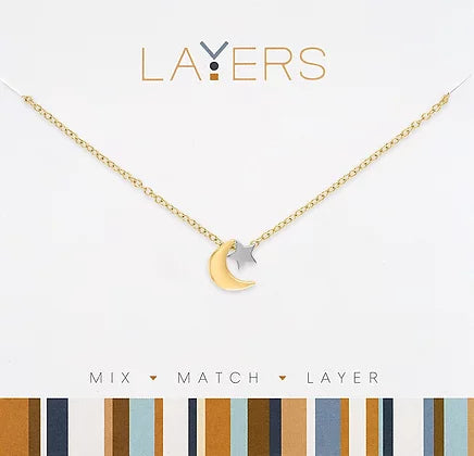 Gold two-tone layered necklace featuring moon and star charms