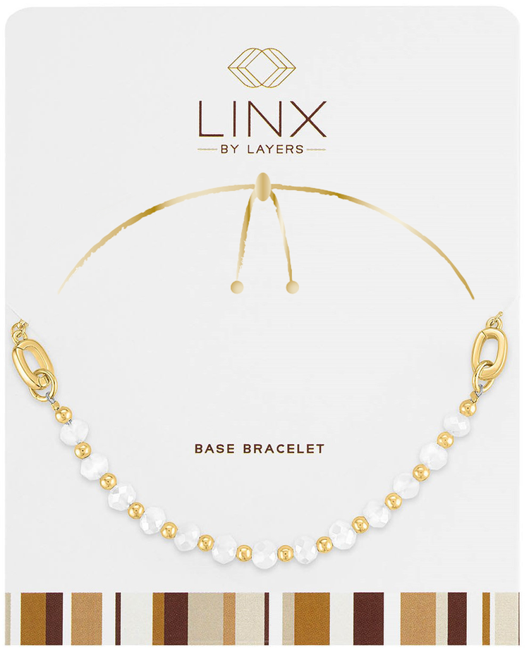 Gold chain bracelet with white faceted accents