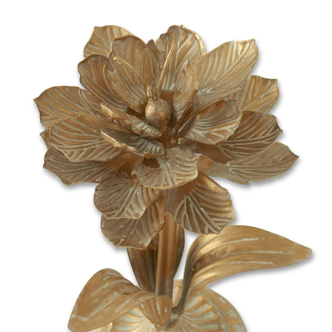 Gold whitewashed metal flower with cement finish in a botanical silhouette