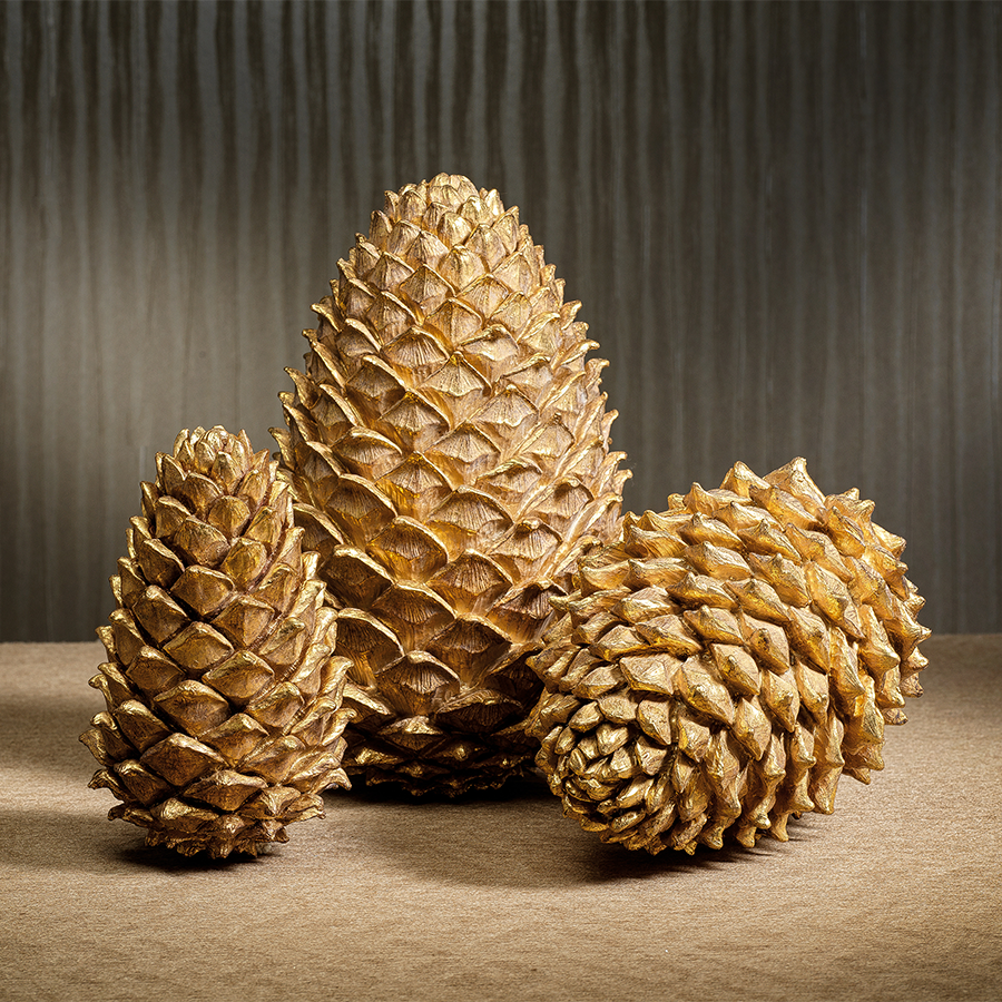 Golden polyresin decorative pine cone ornament with a realistic conical shape.