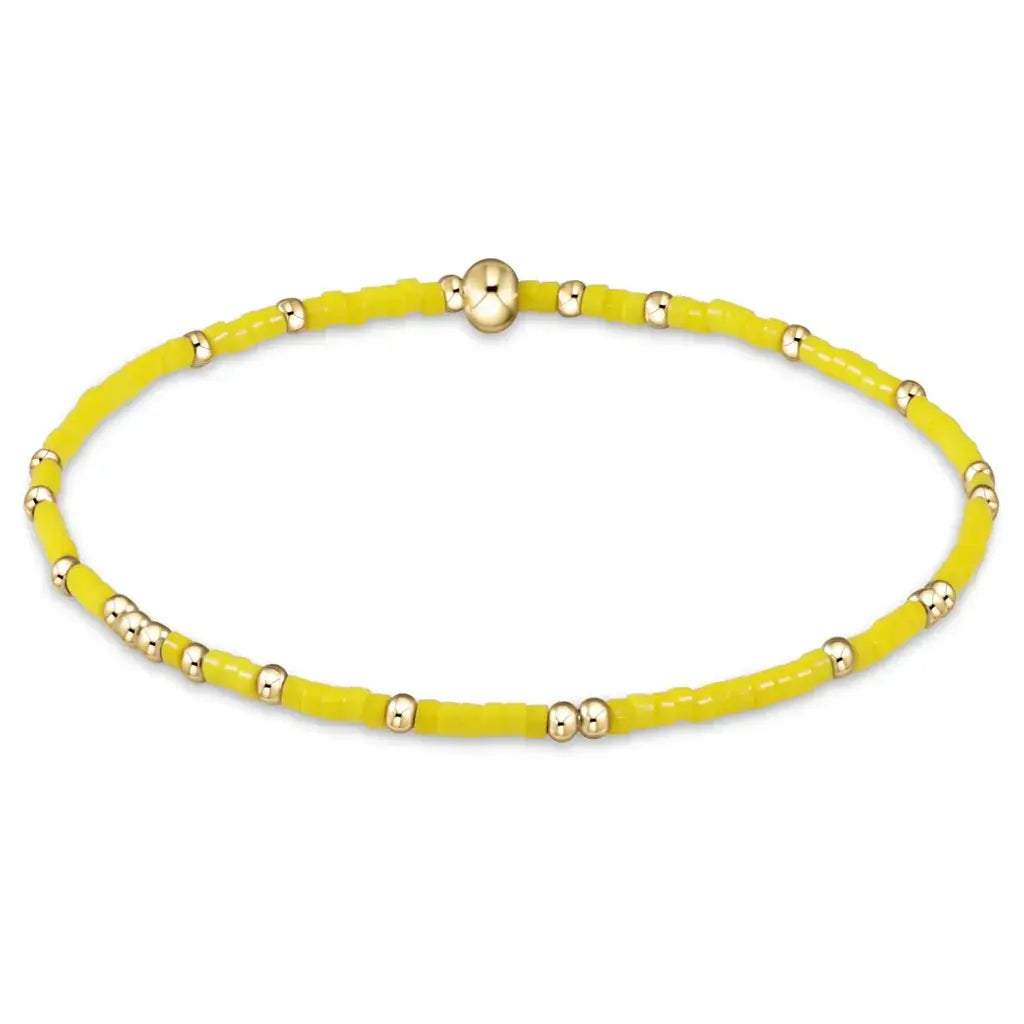 Hand-beaded Gameday Hope Unwritten bracelet in gold and yellow seed beads on stretch elastic.