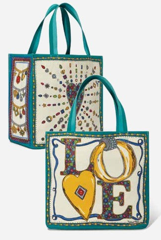 Two Charmed Holiday Love Totes in canvas with teal trim, featuring heart and jewel-themed artwork.