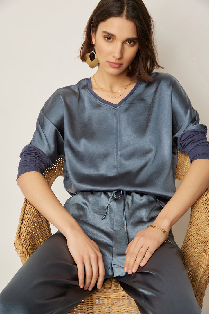 Cassie Satin long sleeve top in viscose fabric with a relaxed silhouette and solid color.