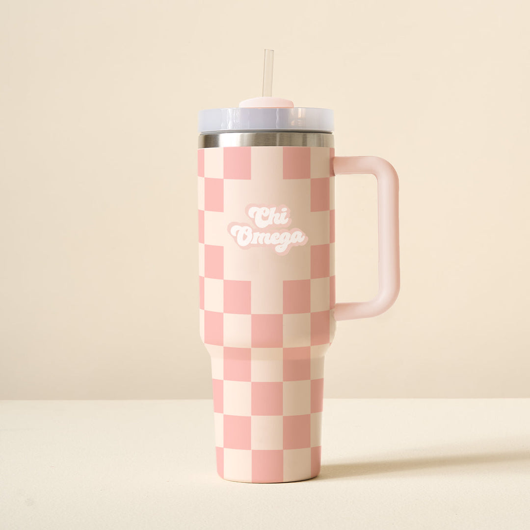 Pink and cream checkered 40 oz tumbler with handle, straw, and Chi Omega logo.