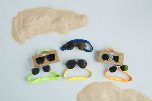Toddler sunglasses with green and blue plastic frames, UV400 protection, and a removable neoprene strap.