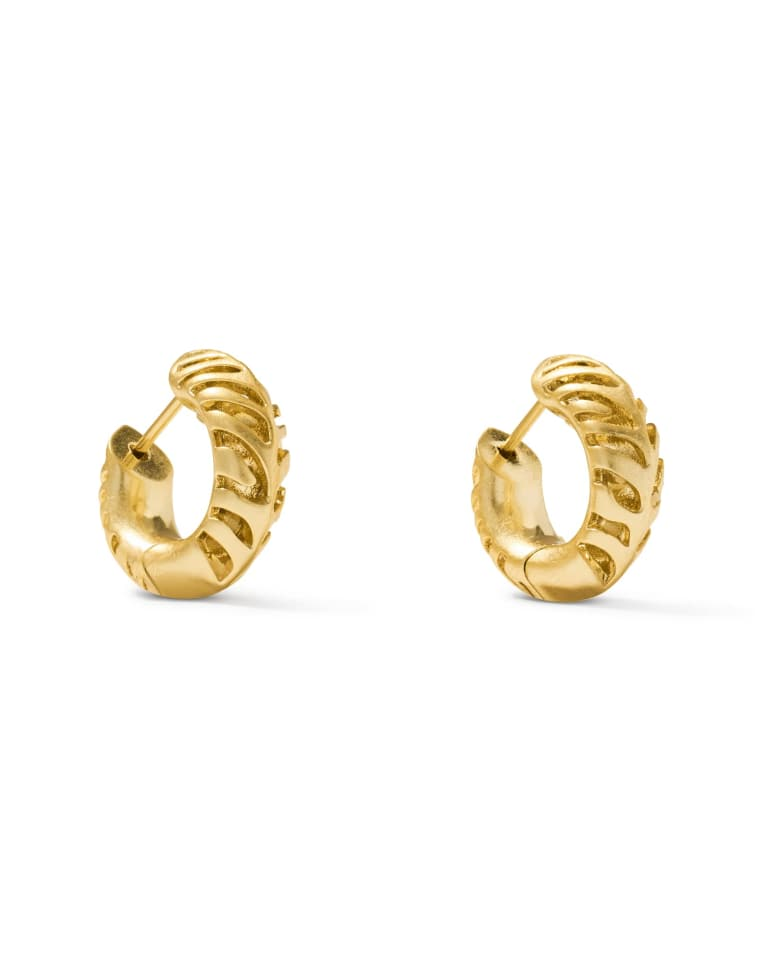 Pair of gold tiger striped Mikki huggie earrings with airy cutout detailing and a rounded form.