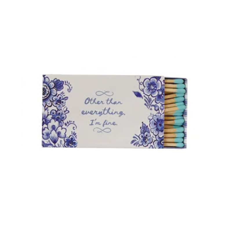 Safety matchbox with blue floral design and text reading 'Other than everything, I'm fine.'