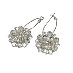 Silver hoop earrings featuring a floral rhinestone flower accent