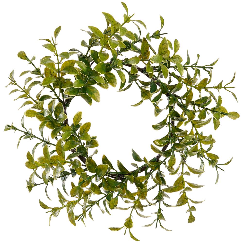 Green boxwood candle ring with plastic foliage on a wire base