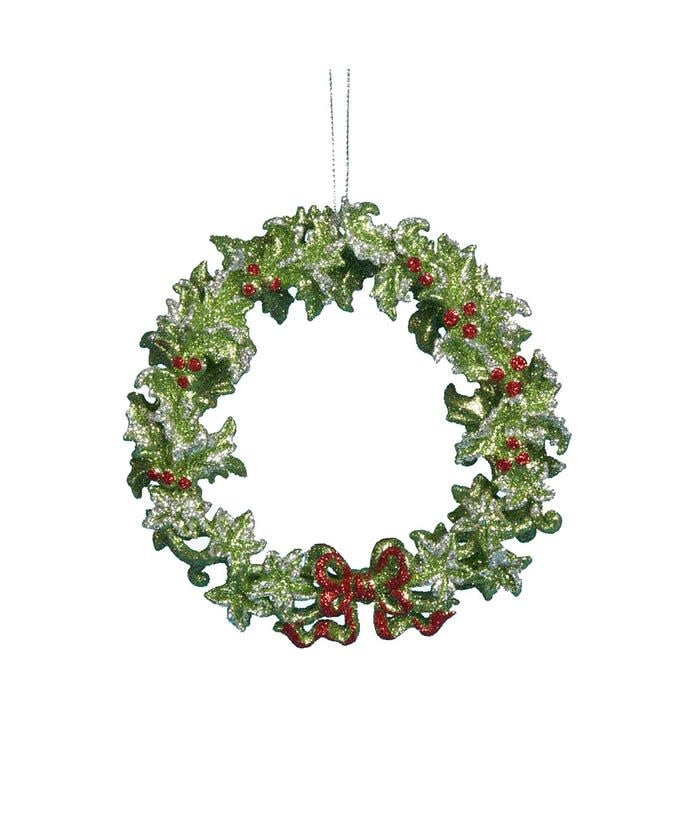 Acrylic green wreath ornament with silver accents, red berries, and a bow.