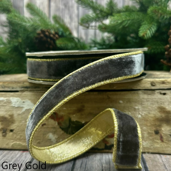 A spool of 1-inch grey velvet ribbon with gold metallic stitched edges.
