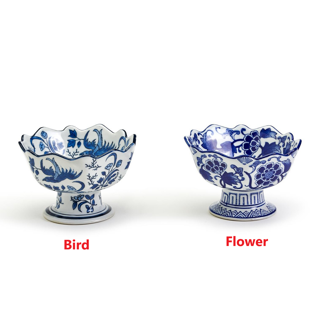 Two blue and white hand-painted porcelain footed bowls with scalloped edges in bird and flower designs.