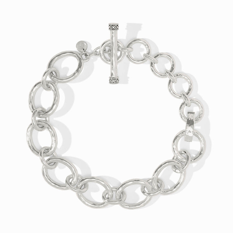 Silver-plated hammered link extender with a toggle clasp and circular links.