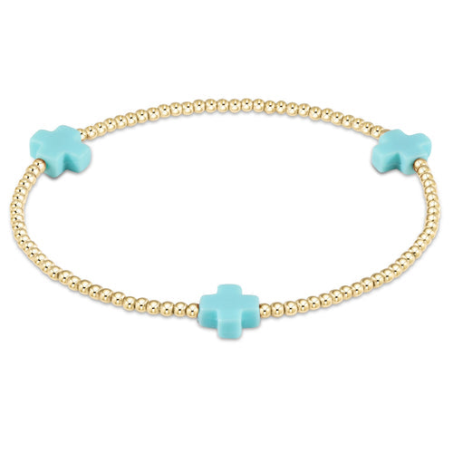 Signature Cross gold-filled bracelet with a cross bead pattern on elastic cord