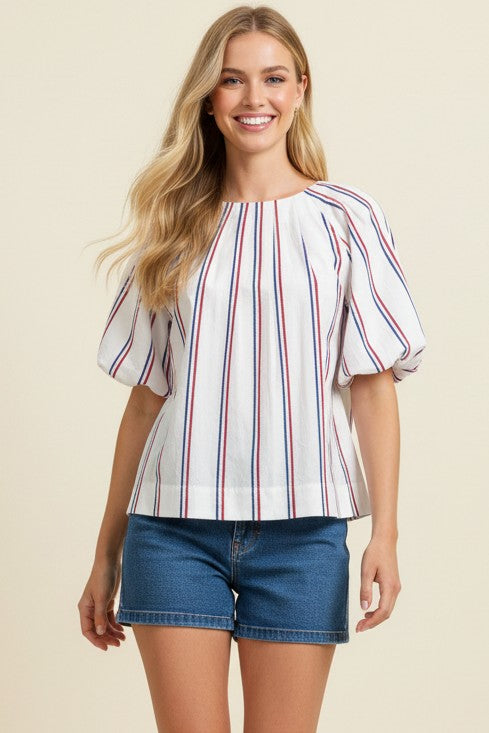 Women's Stella striped cotton blouse with balloon sleeves, round neck, back buttons, and tucked detail in white.