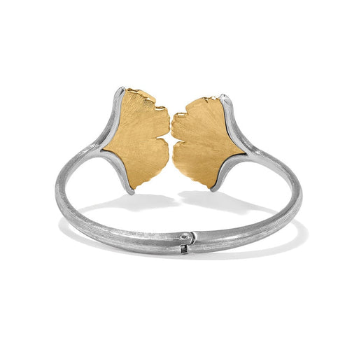 Silver-gold hinged bangle bracelet featuring fine quality crystals in a two-tone finish.