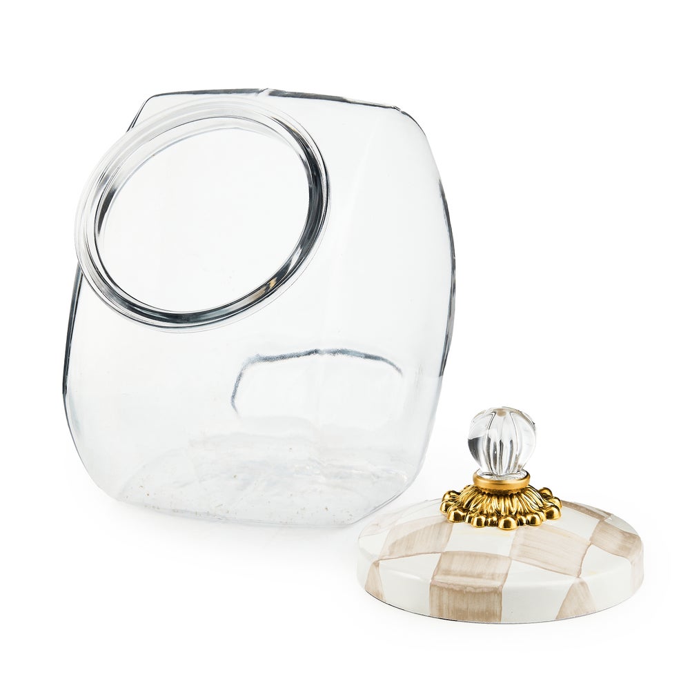 Glass cookie jar with hand-glazed steel lid featuring painted mocha check pattern.