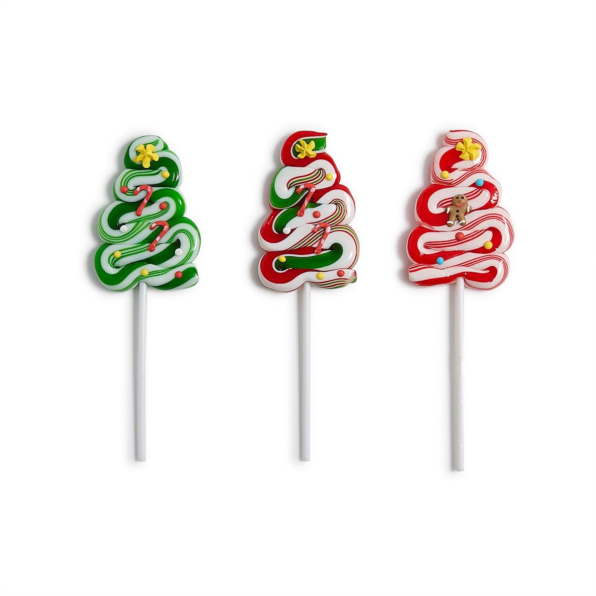 Three peppermint Christmas tree swirl lollipops in green, red, and white with icing decorations.