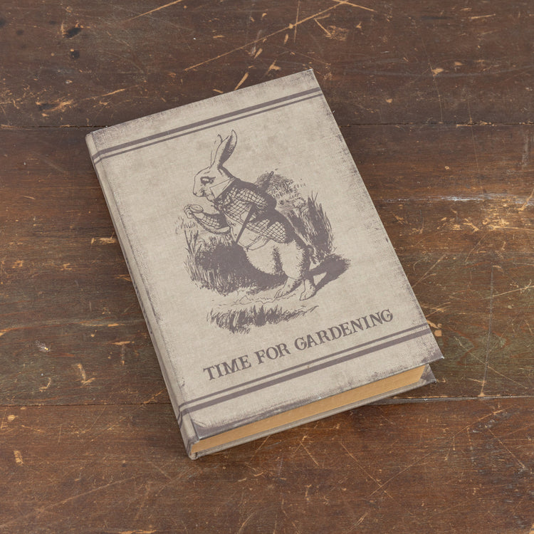 Hardcover gardening journal with wood cover featuring a botanical illustration on the front.