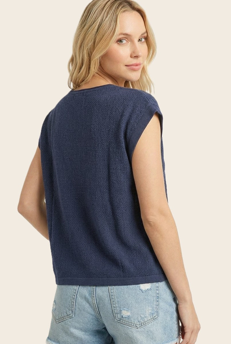 Isabelle Pointelle short sleeve sweater top in white with a slit neck detail.