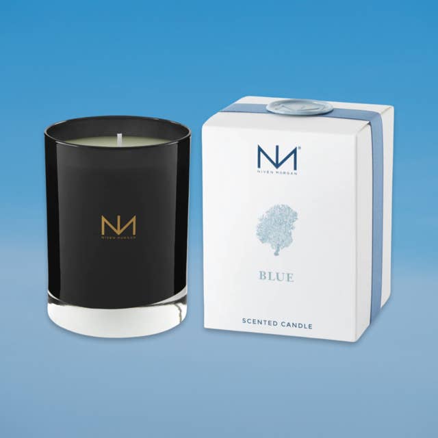 Dark navy blue soy blend candle in an approx. 11-ounce glass jar with a black wick.