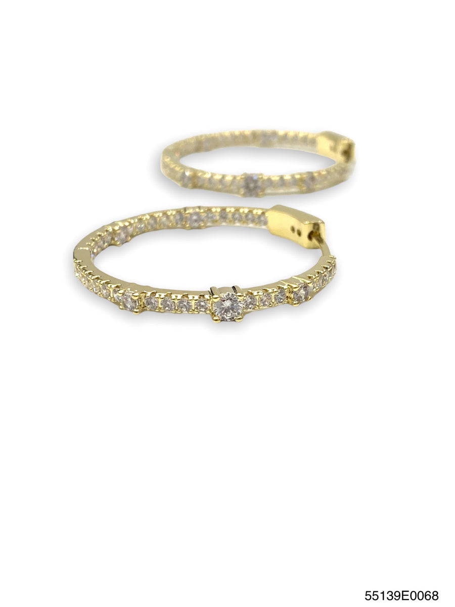 Lea Inside Out hoop earrings in gold metal with a two-tone silver interior finish.