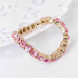 Pink sparkle stretch bracelet with a 2.5-inch diameter featuring shimmering stones.