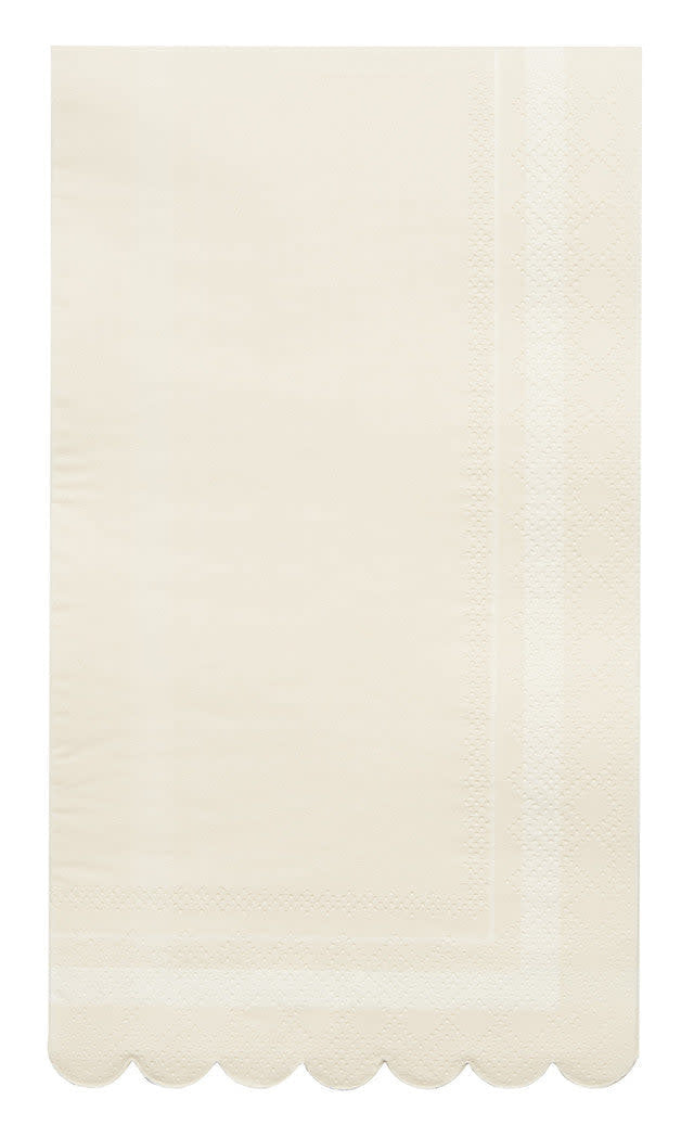 Cream scalloped-edge guest towel made from sustainable compostable paper.