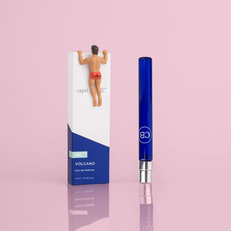 Volcano Eau de Parfum 0.34 fl oz blue glass spray bottle next to its white and blue box.