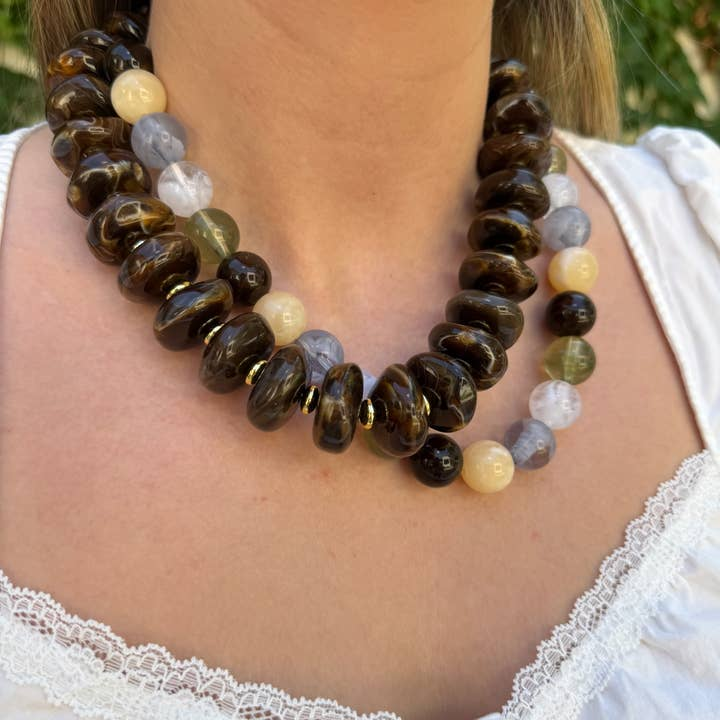 Woman wearing the Randi Chunky Beaded Necklace with large marbled brown and multi-colored beads.