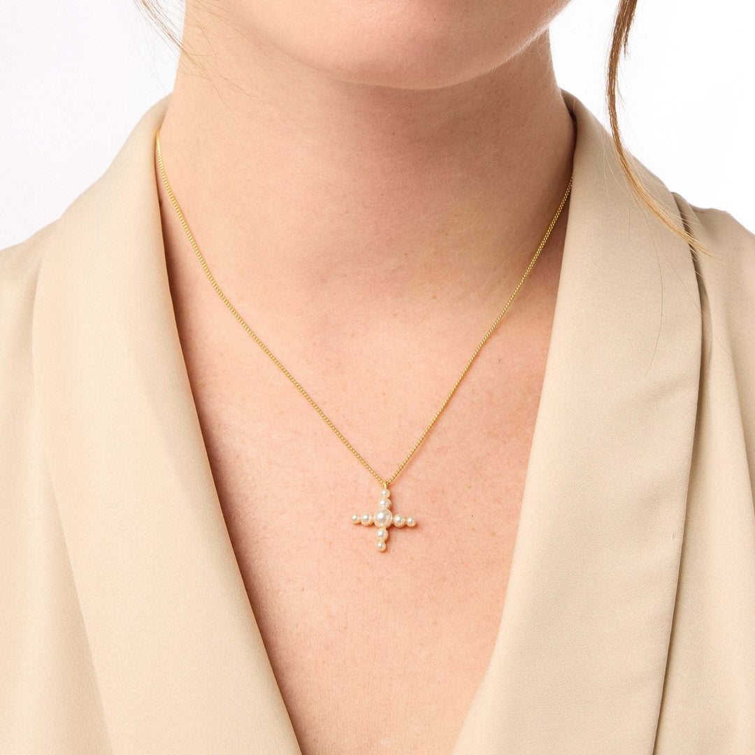 Delicate curb chain necklace with a cross-shaped pendant featuring gemstone beads in reconstituted stone and 24K gold plating.