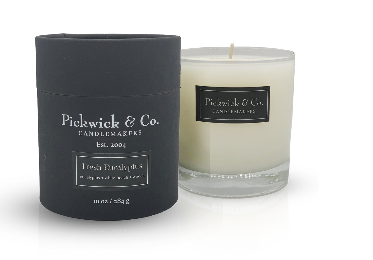 Pickwick Candle in a clear glass jar with a white wick.