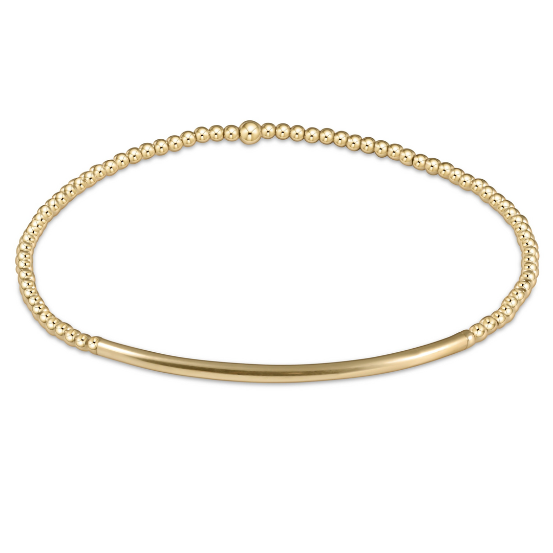 Bliss Bar Gold 2mm Bracelet featuring 14kt gold-filled beads and a smooth curved bar on elastic.