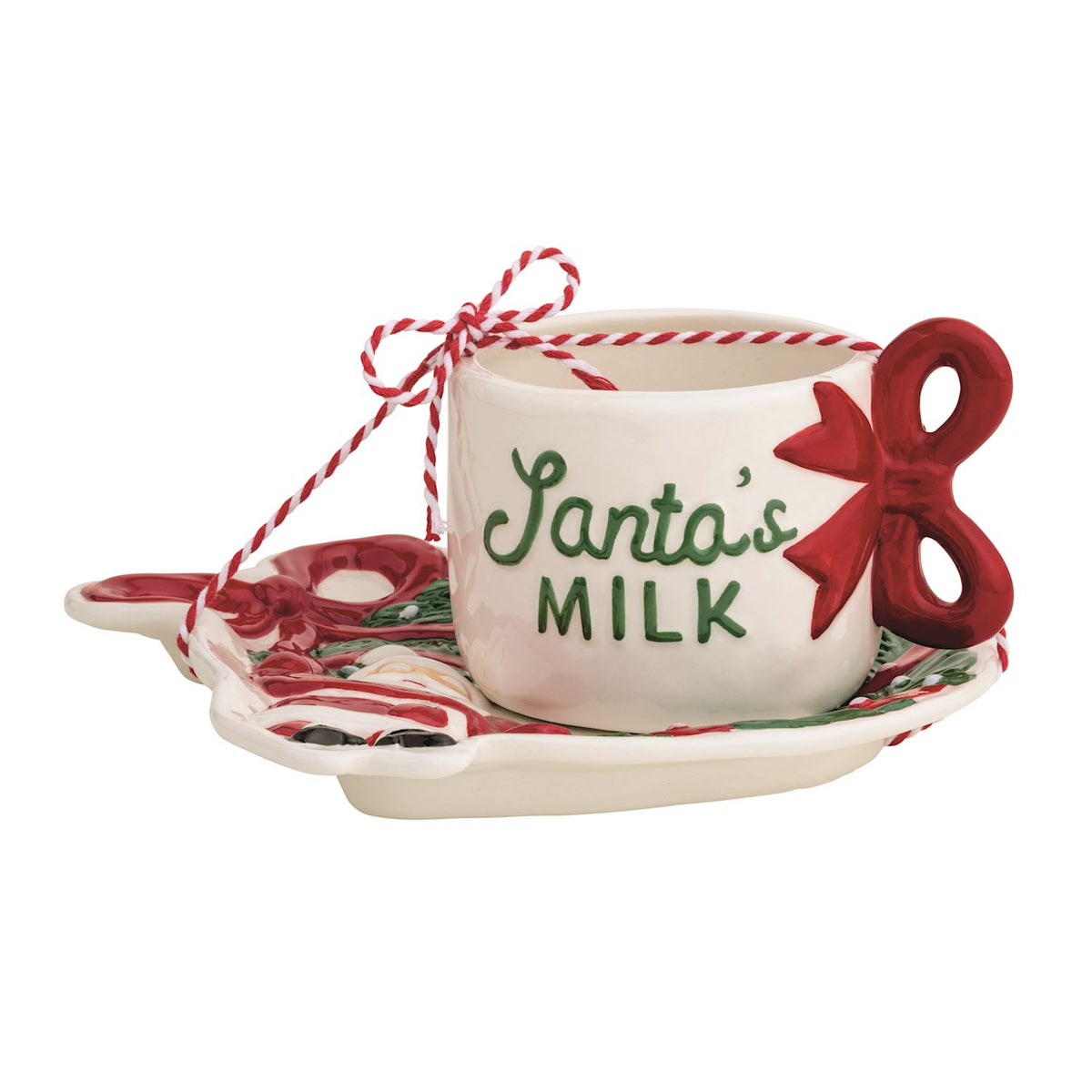 Ceramic Santa's Milk mug with a red bow handle sitting on a matching cookie plate.