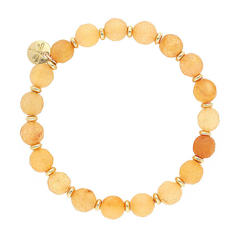 Lizas Beaumont Natural Bracelet with orange stone beads, gold spacers, and a dragonfly charm.
