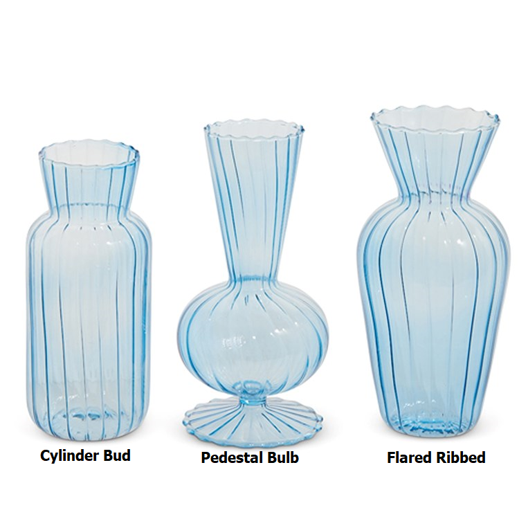 Glass vase with blue hue, cylindrical shape measuring six inches tall.