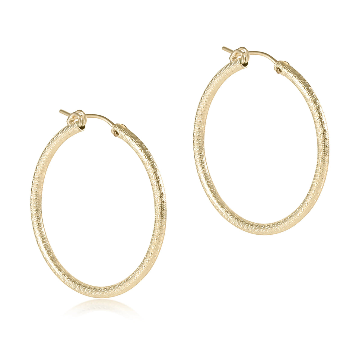 Round 1.25 inch textured 14kt gold-filled hoop earrings with a notch clasp.