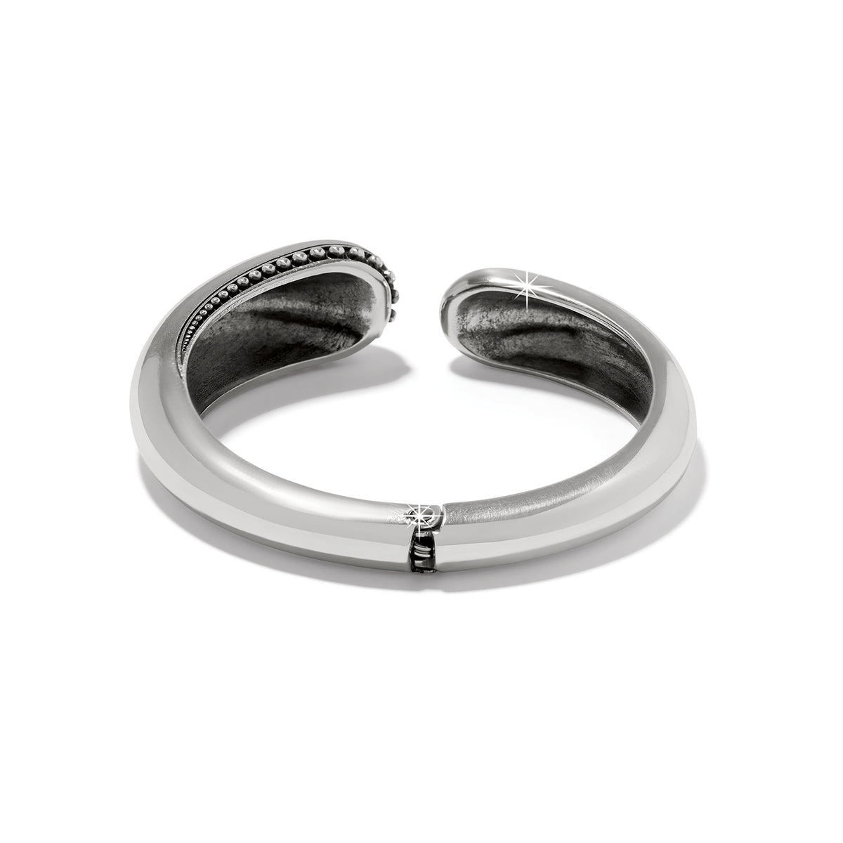 Silver plated Pretty Tough Droplet Hinged Bangle with a smooth finish and beaded edge detail.