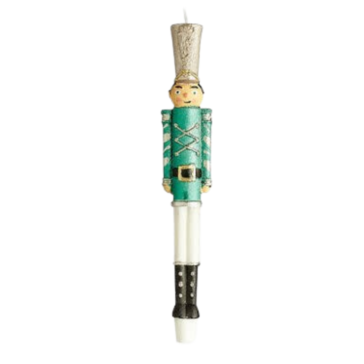 Nutcracker soldier taper candle with green uniform, silver hat, and white legs.
