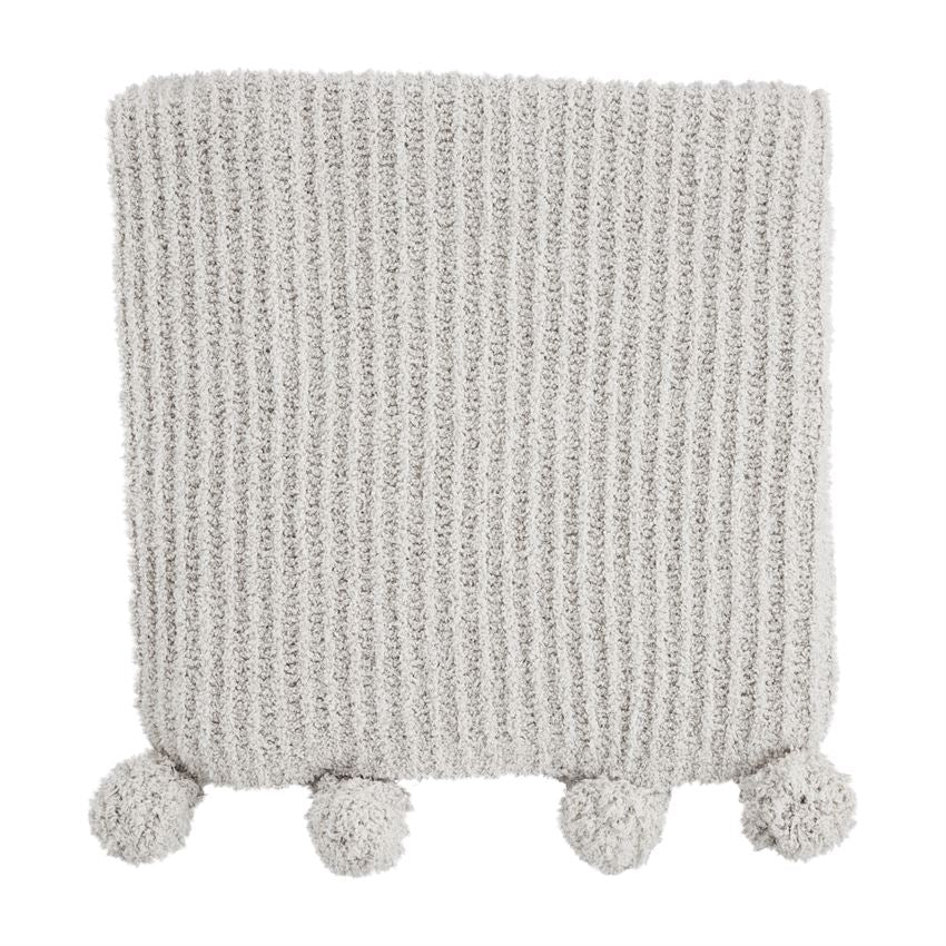 Chenille Pom blanket in soft beige with a textured pom-pom pattern.