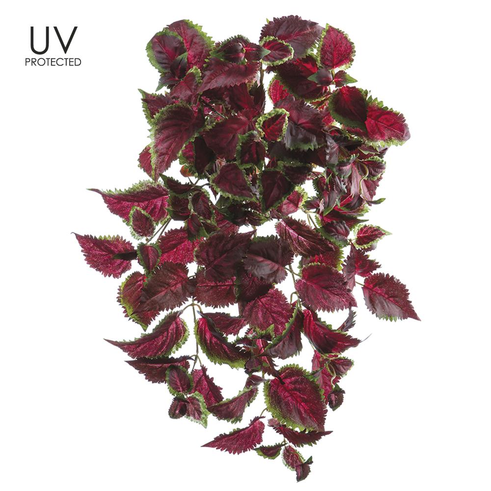 Hanging artificial Coleus bush with vibrant foliage in a metal wire frame.