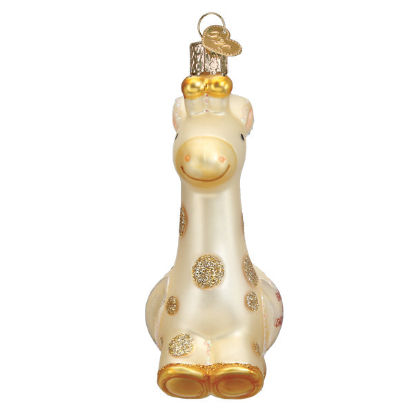 Baby's First Christmas Giraffe glass ornament with gold glitter spots and a heart-shaped tag.