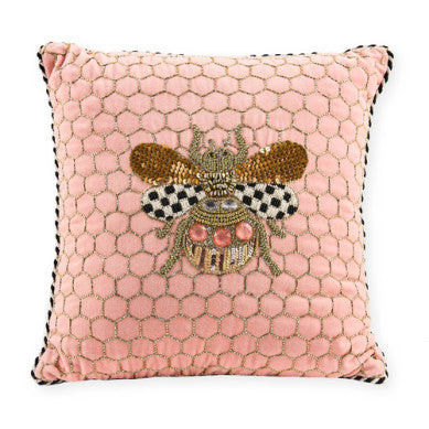 Pink cotton throw pillow with Queen Bee motif